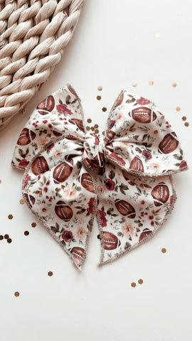 TT | FLORAL FOOTBALL SASSY HAIR BOW